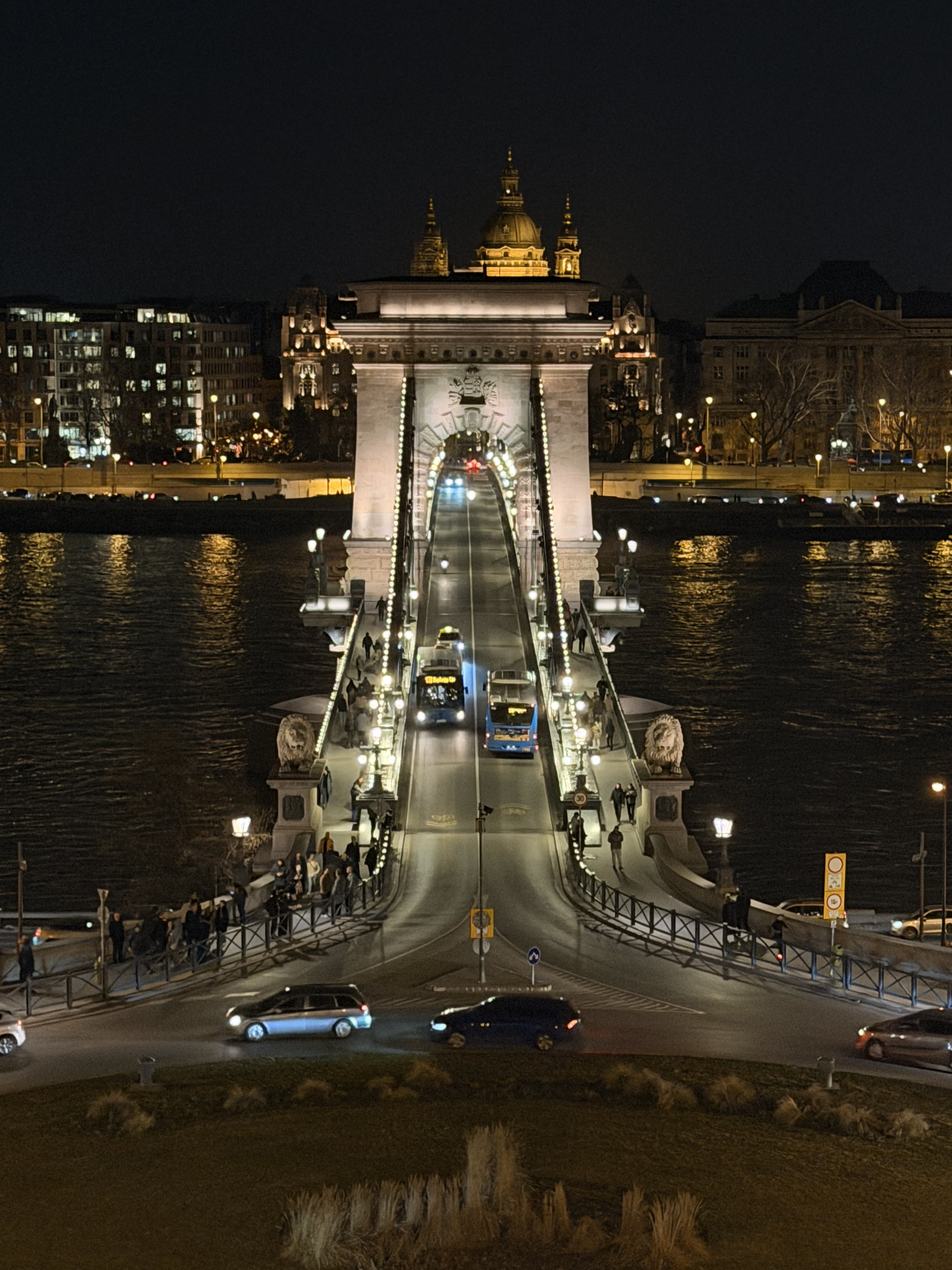 The Chain Bridge lit at night with St Stephen's Basilica behind it