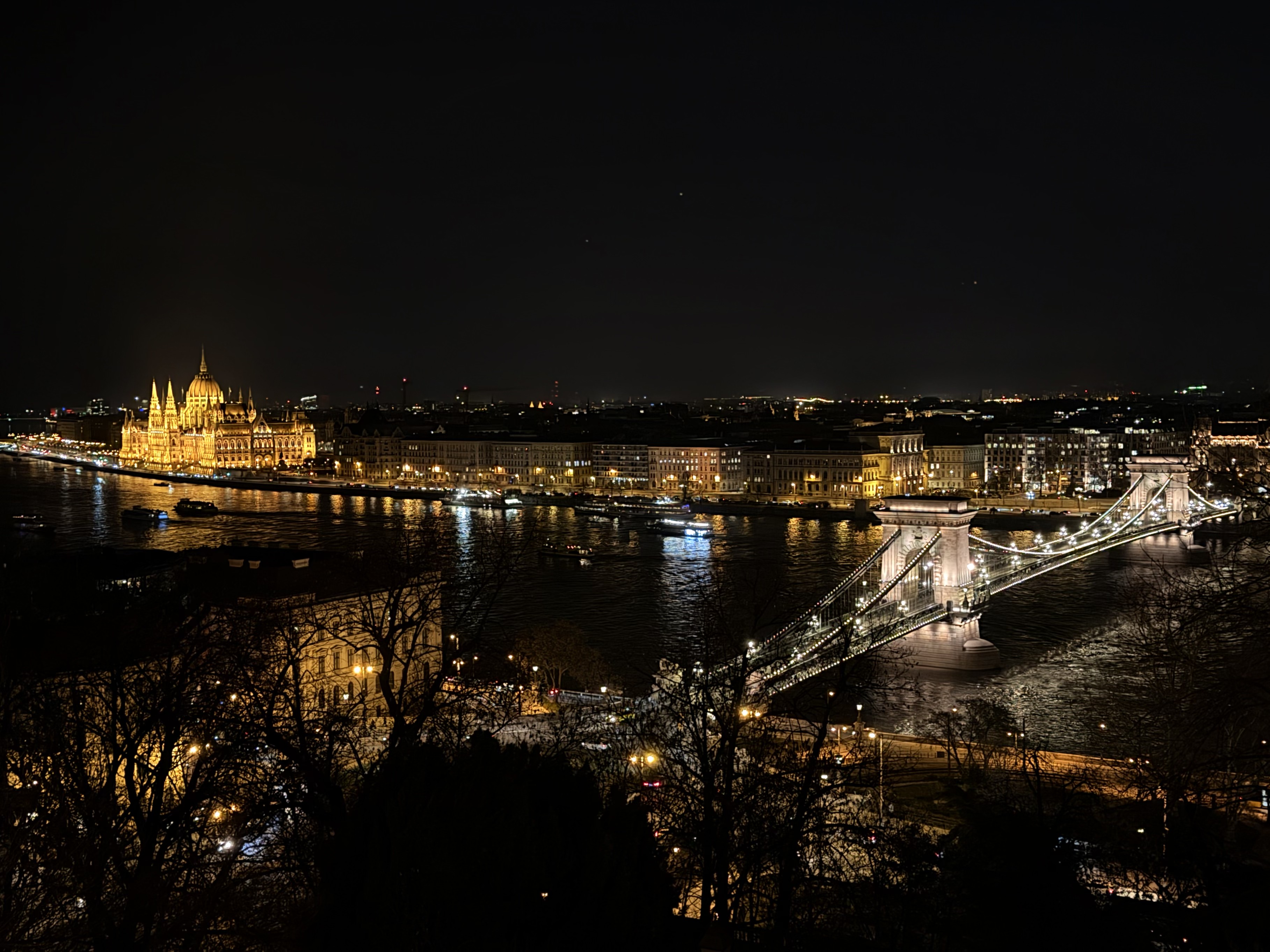 Budapest at night: the illuminated Chain Bridge and Parliament over the Danube, seen from Gellért Hill