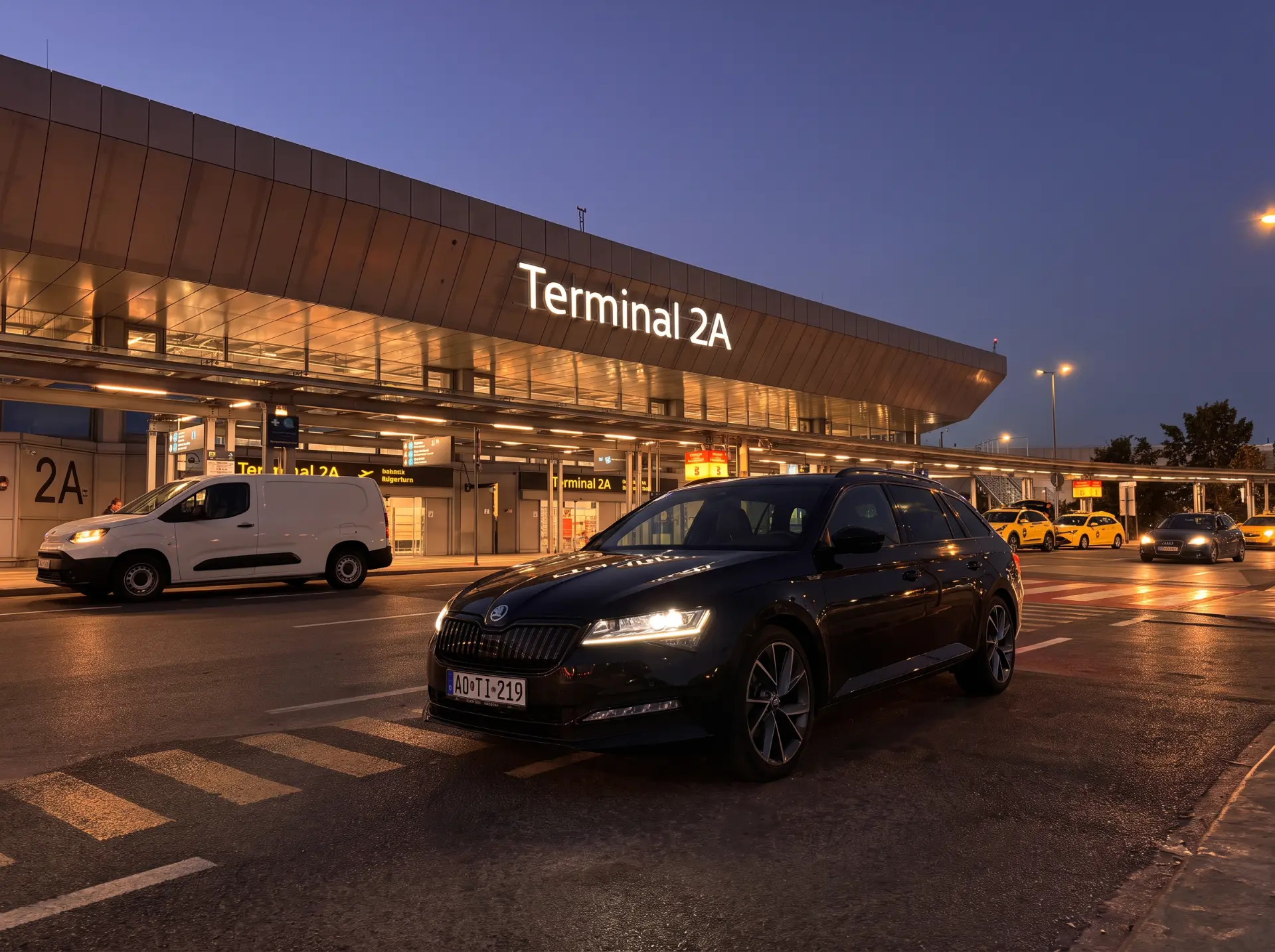 Black Skoda Superb at the airport terminal